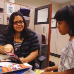 Jessica Bills -- Financial aid adviser Monica Martinez assists Rebecca Bernard, with her financial aid questions. Loans are the primary sources of student aid.